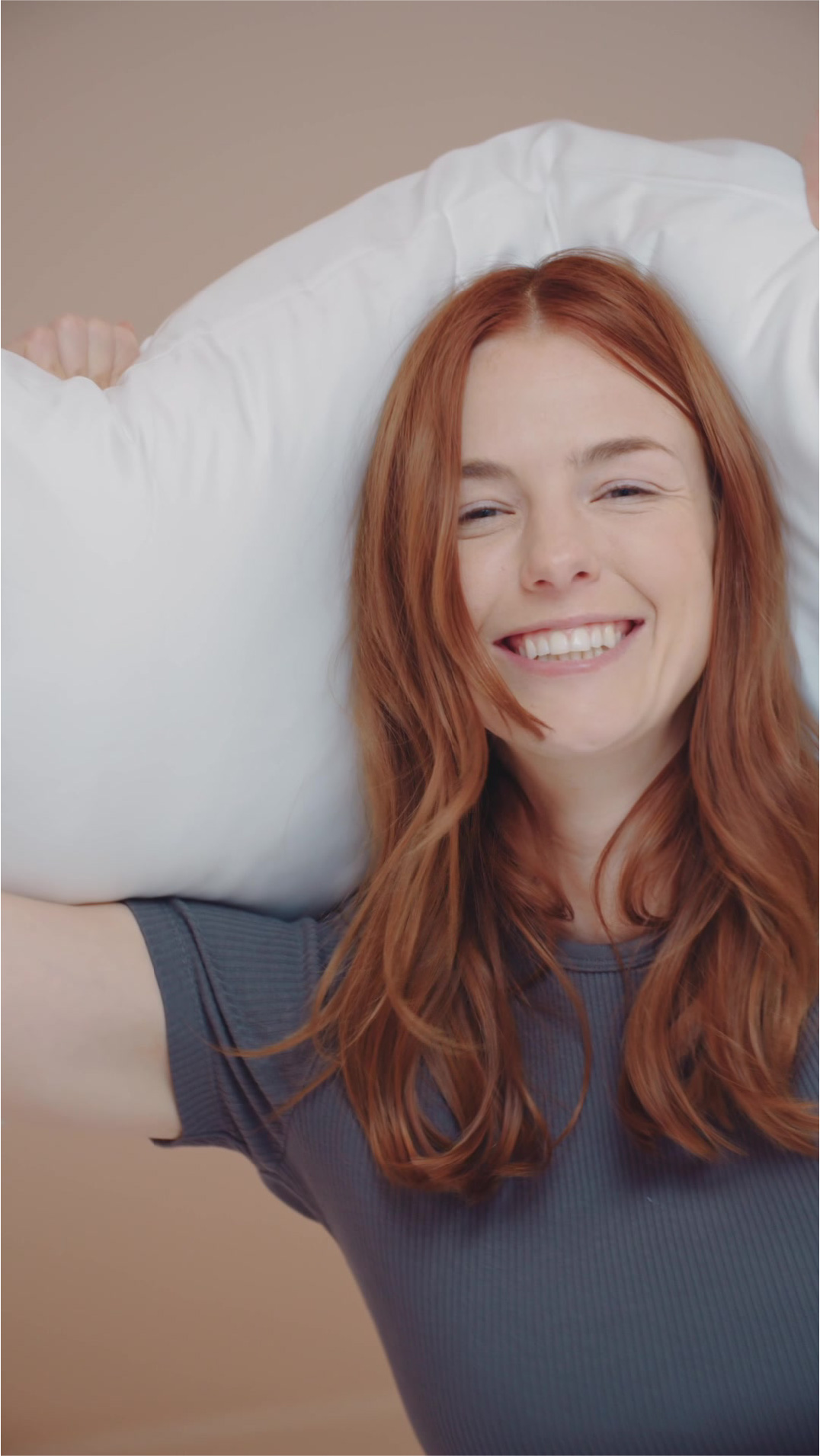 Holding pillow and smile