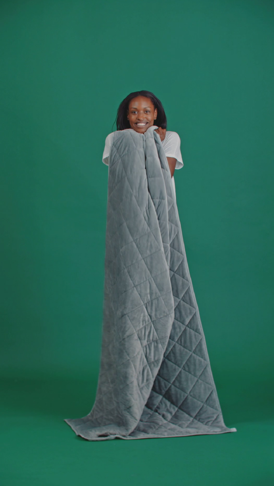 Girl holding weighted blanket